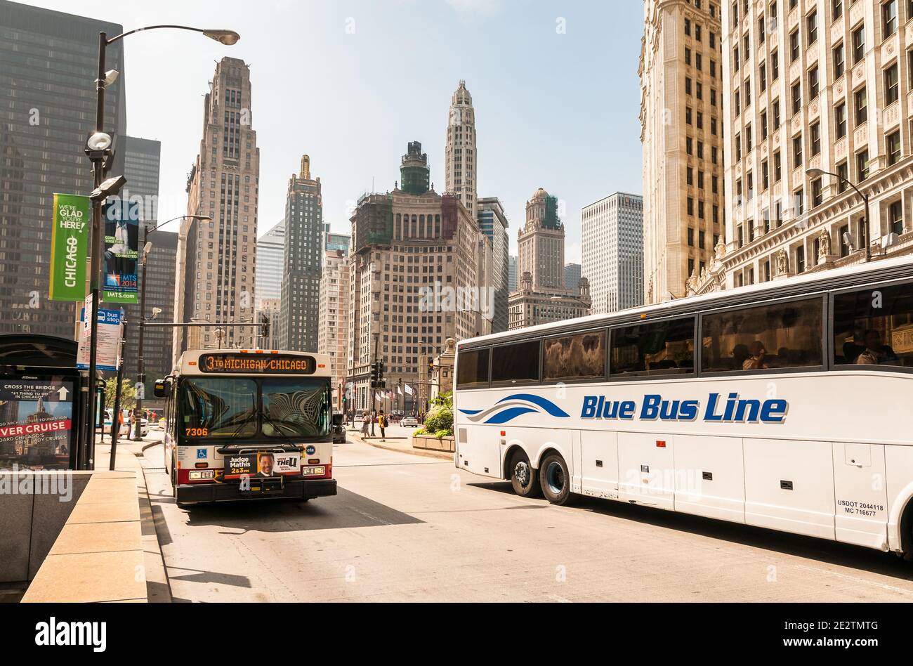 Chicago, Illinois, USA - August 24, 2014: Urbane street of Chicago Downtown. Urban landscape with towers, skyscrapers and public transport in a summer Stock Photo