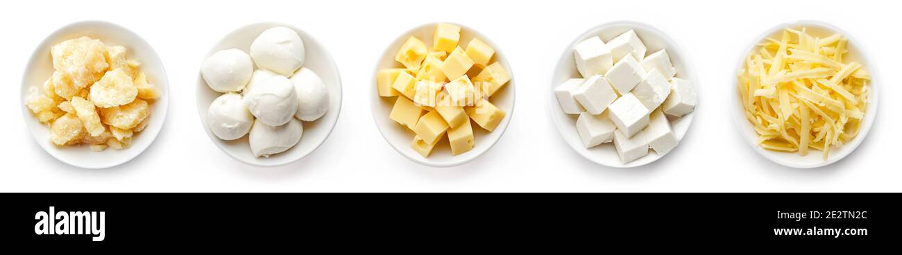 Bowls of parmesan, Mozzarella, diced, grated and soft cheese isolated on white background, top view Stock Photo