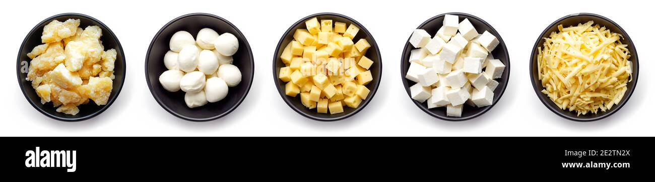 Bowls of parmesan, Mozzarella, diced, grated and soft cheese isolated on white background, top view Stock Photo