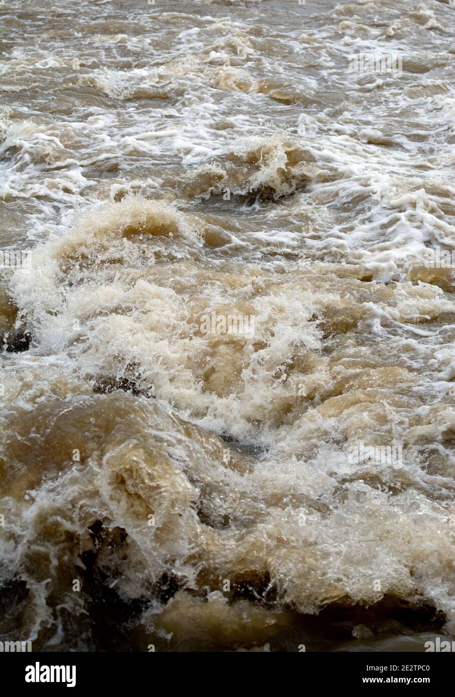 Turbulent water at a weir after heavy rainfall, Warwickshire, UK Stock Photo