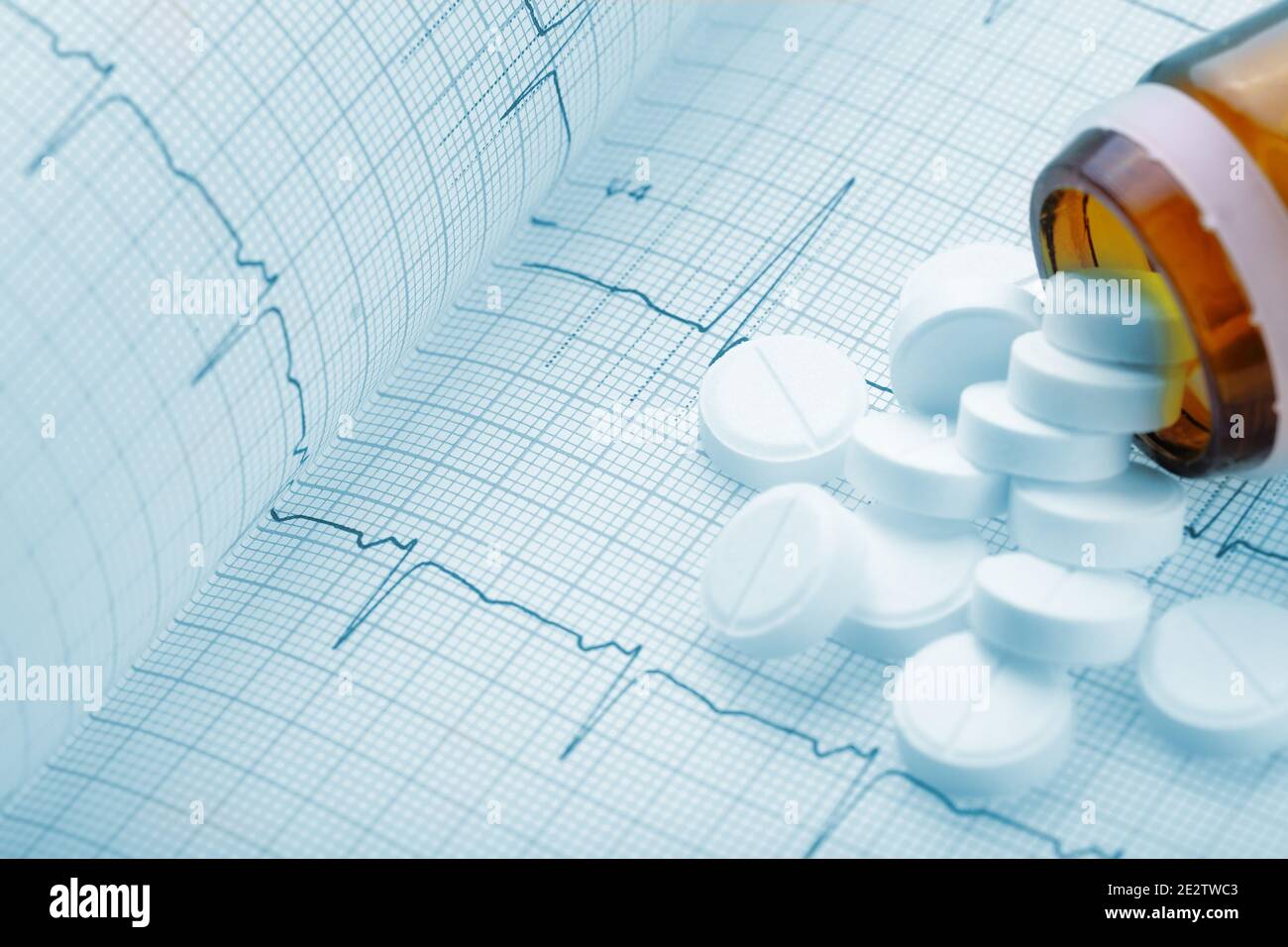 Medical pills on the background of a cardiogram Stock Photo