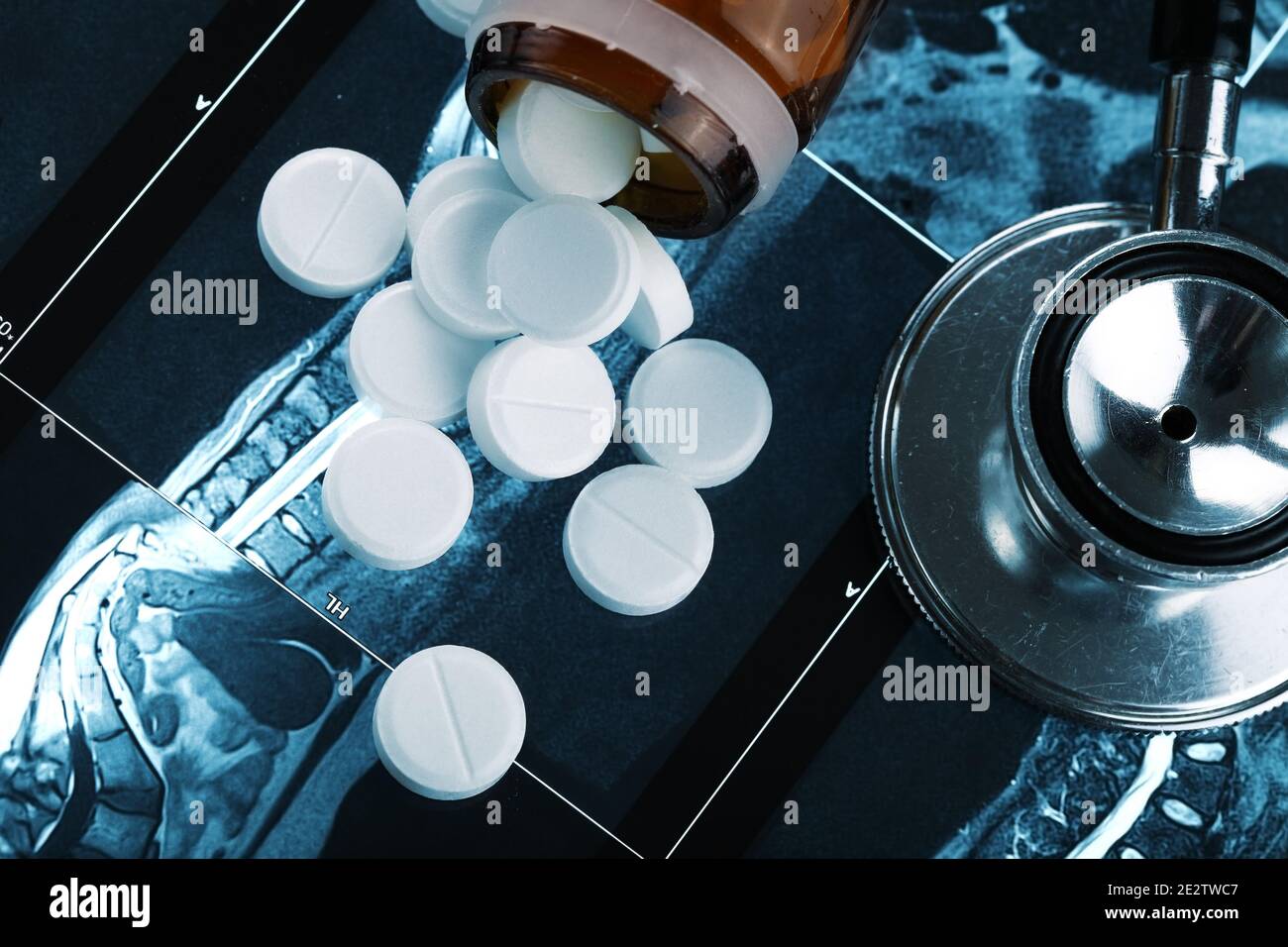 Handful of white round pills on a st-scan Stock Photo