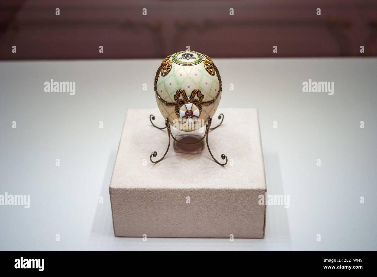 Saint Petersburg, Russia - ca. December 2017: White Faberge Easter Egg called the Order of Saint George Egg at the Faberge Museum in the Shuvalov Pala Stock Photo