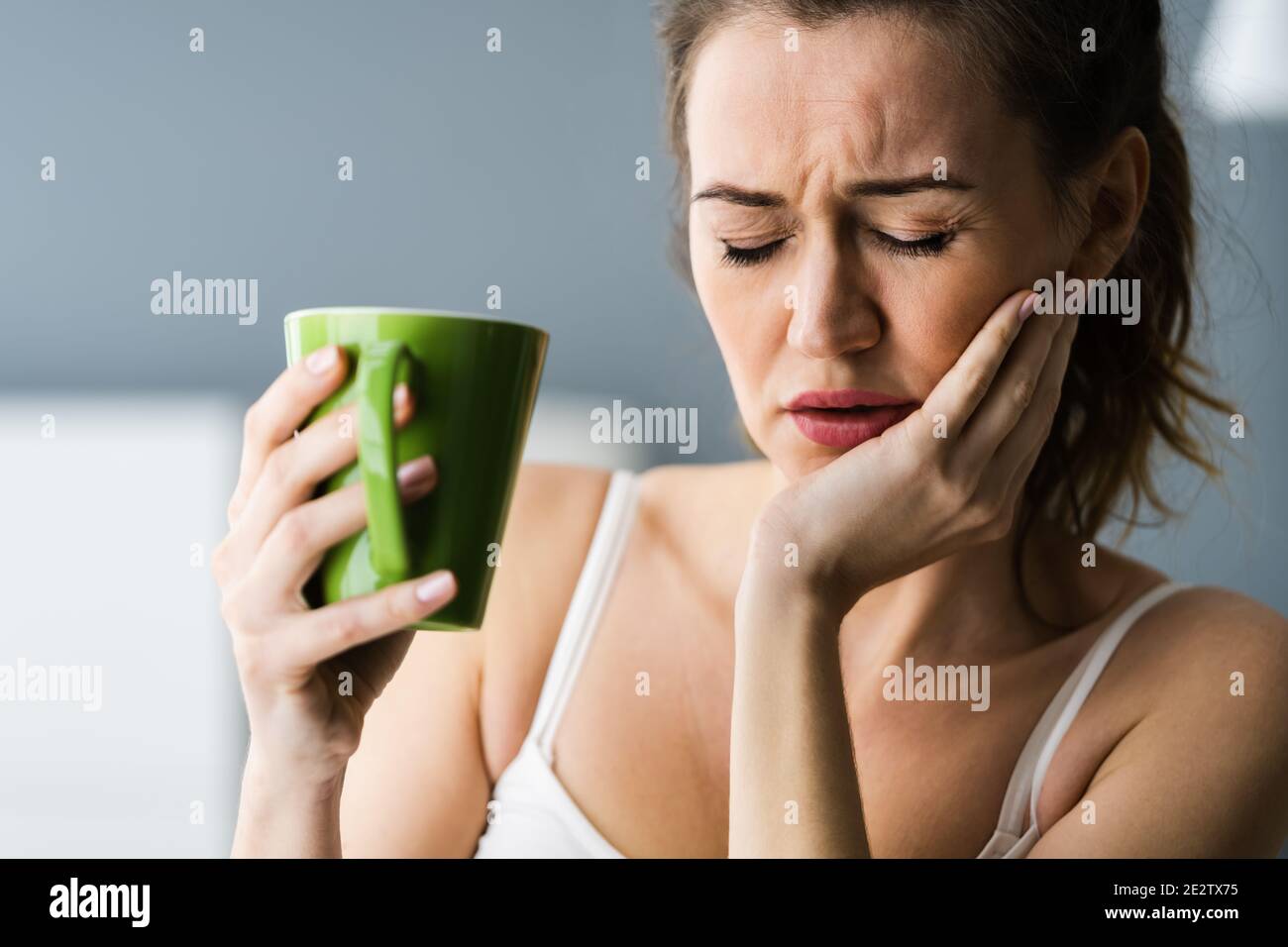 Tooth Ache And Pain Drinking Hot Drink Stock Photo Alamy