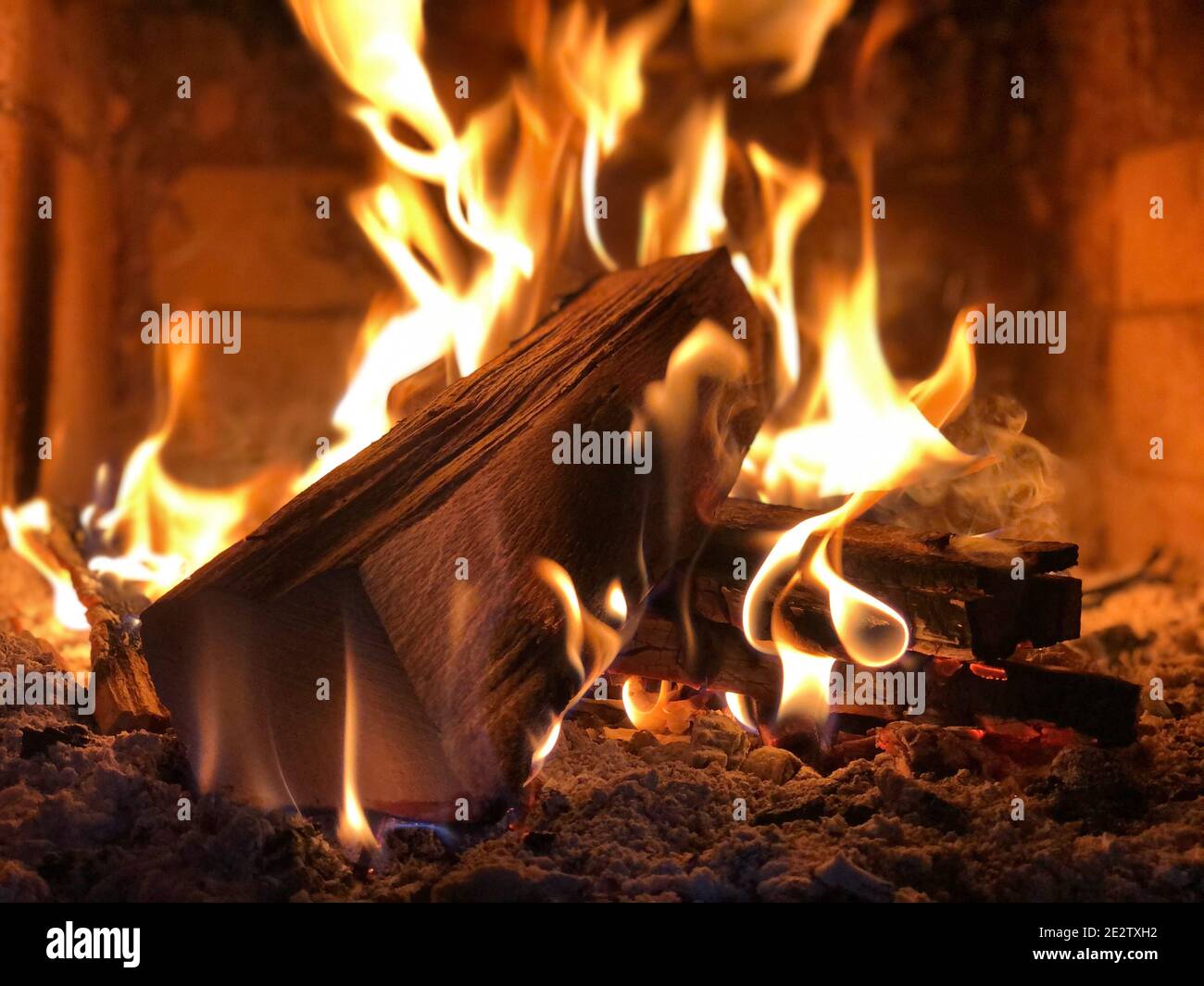Closeup of woods burning in a small fireplace Stock Photo - Alamy