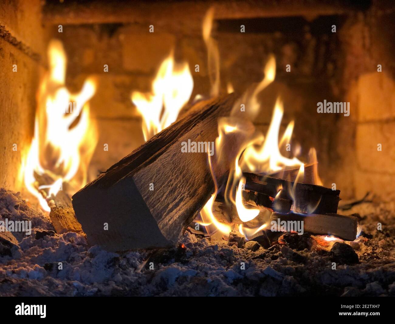 Closeup of woods burning in a small fireplace Stock Photo - Alamy