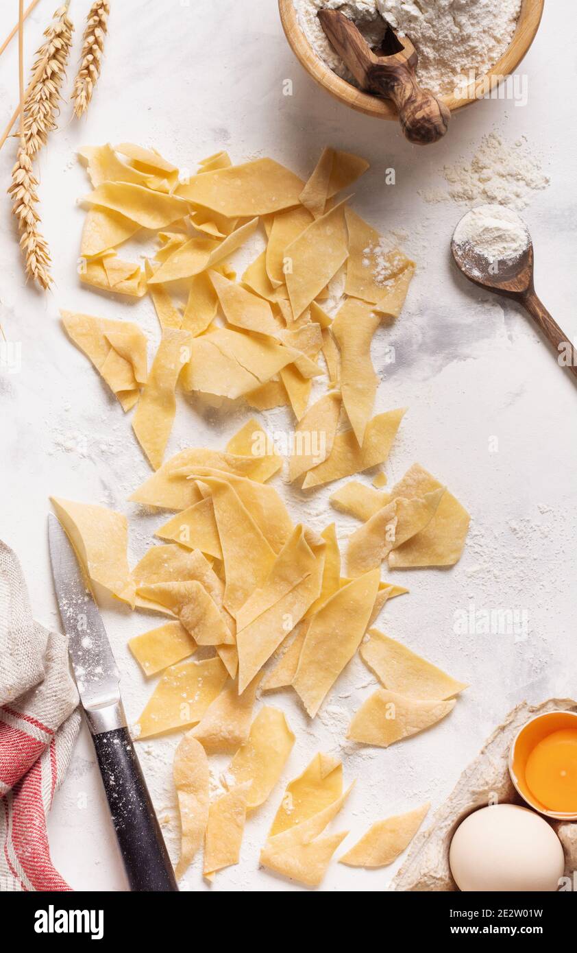 Baking background with cooked Homemade and freshly made pasta