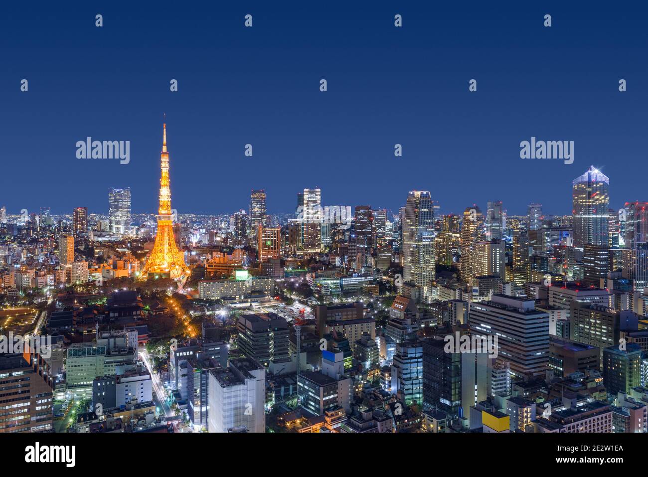 Tokyo, Japan modern urban skyline at night overlooking the tower. Stock Photo