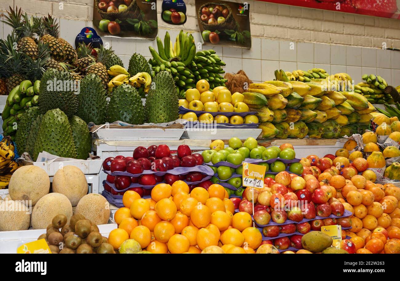 fresh fruits stacked, produce stand, nutritious food, colorful