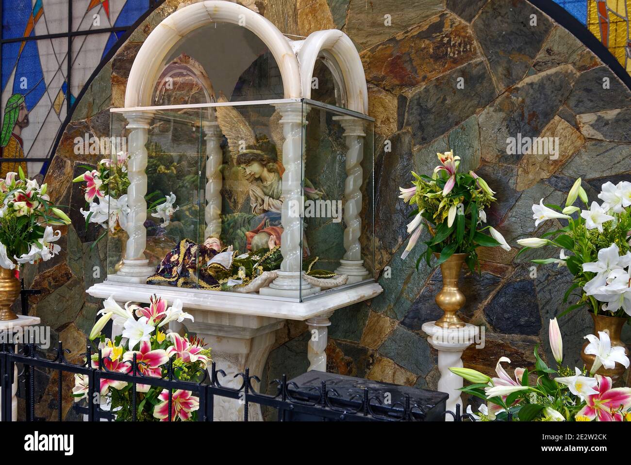 angels and flowers, wayside shrine, marble case, vases, iron fence, outdoor decoration, South America, Quito, Ecuador Stock Photo