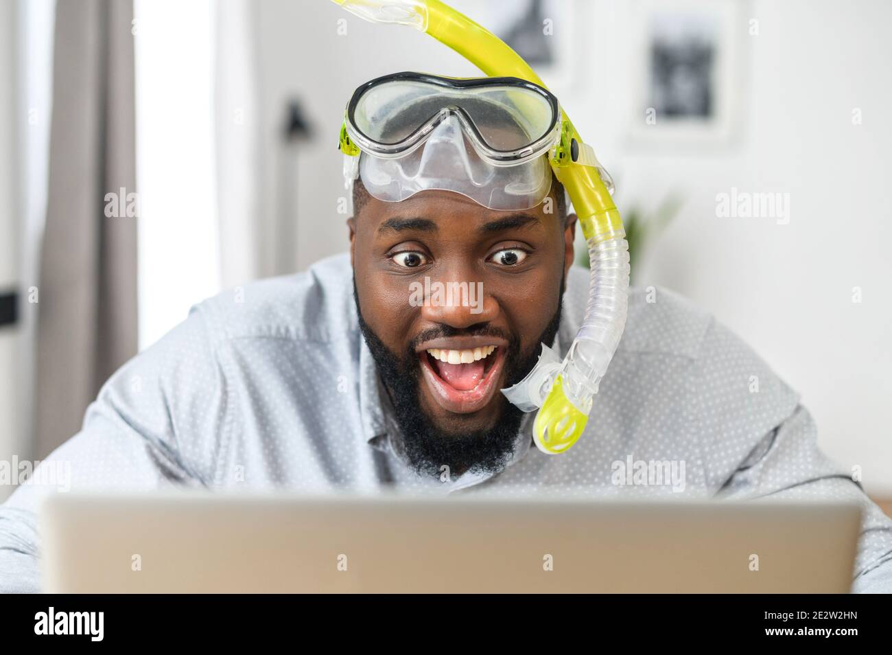 Multiracial guy wearing diving mask indoor Stock Photo