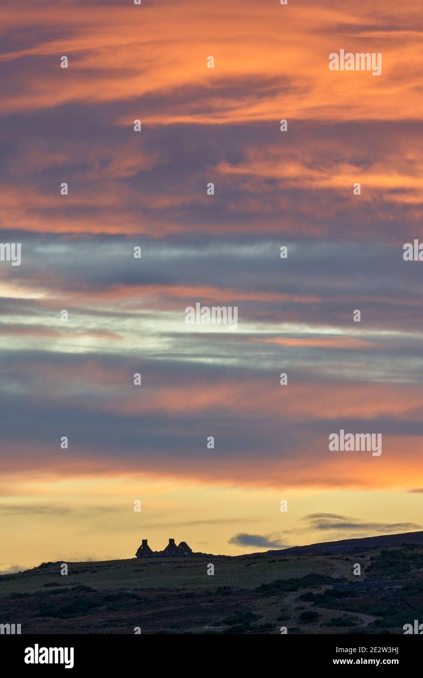Ruin on skyline at sunset, near Dava, Badenoch and Strathspey, Highland, Scotland. Stock Photo