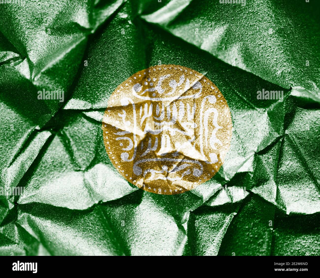 Rohingya flag painted on crumpled paper background. Stock Photo