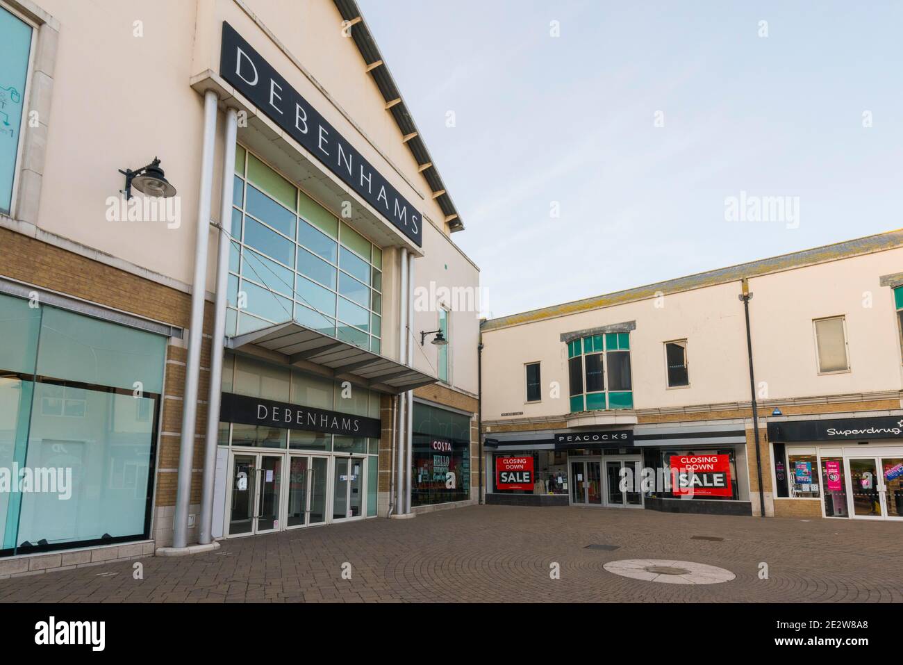 Weymouth, Dorset, UK.  15th January 2021.  General view of the Debenhams department store at Weymouth in Dorset which will not be re-opening when lockdown ends.  Next to it is a Peacocks shop which has closing down sale signs in the window. Picture Credit: Graham Hunt/Alamy Live News Stock Photo