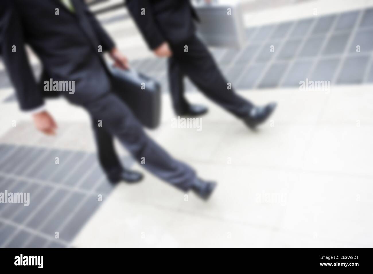 Blurred shot of business people walking together Stock Photo