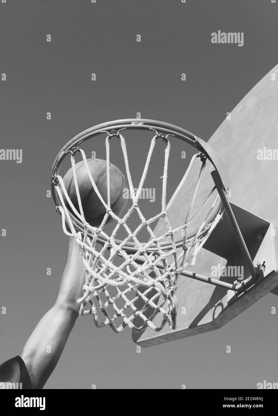 Black and white photo of Player Dunking the Ball Stock Photo