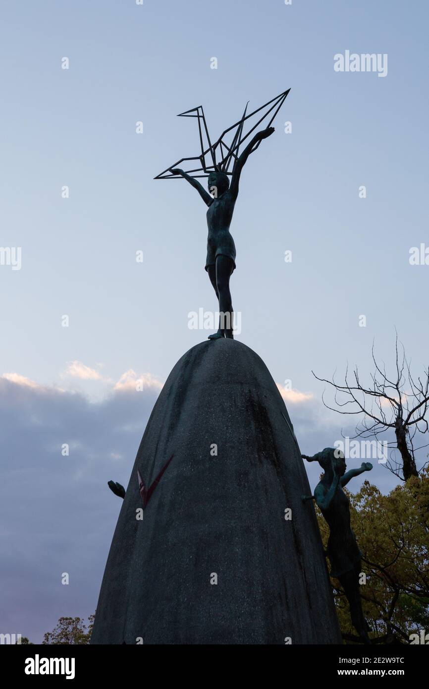 Children's Peace Monument, silhouetted against the sky at twilight, Hiroshima, Japan Stock Photo