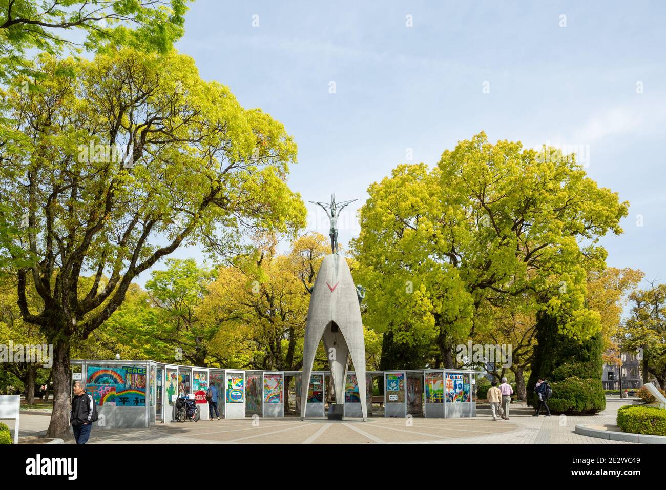 Children's Peace Monument, with boards showing paper cranes below, and trees around, Hiroshima, Japan. Stock Photo