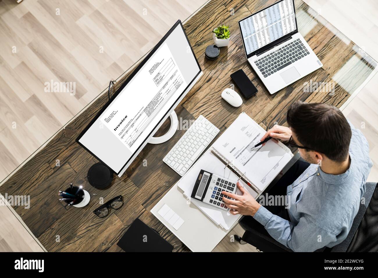 Chartered Tax Accountant Using Modern Invoice Billing Software Stock Photo