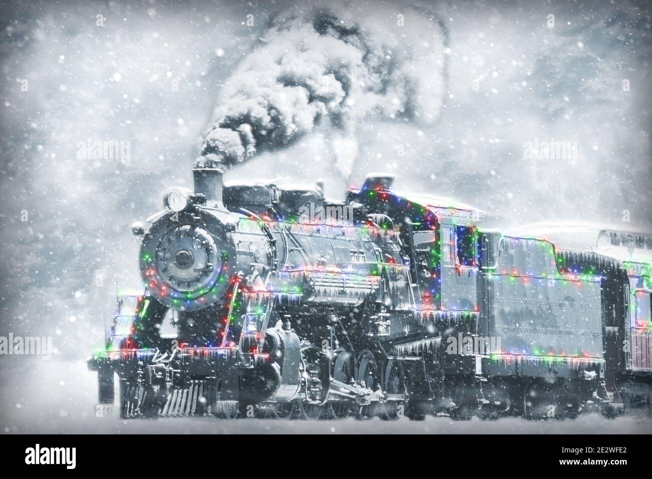 A Restored Steam Engine With Christmas Lights on it in a Snow Storm