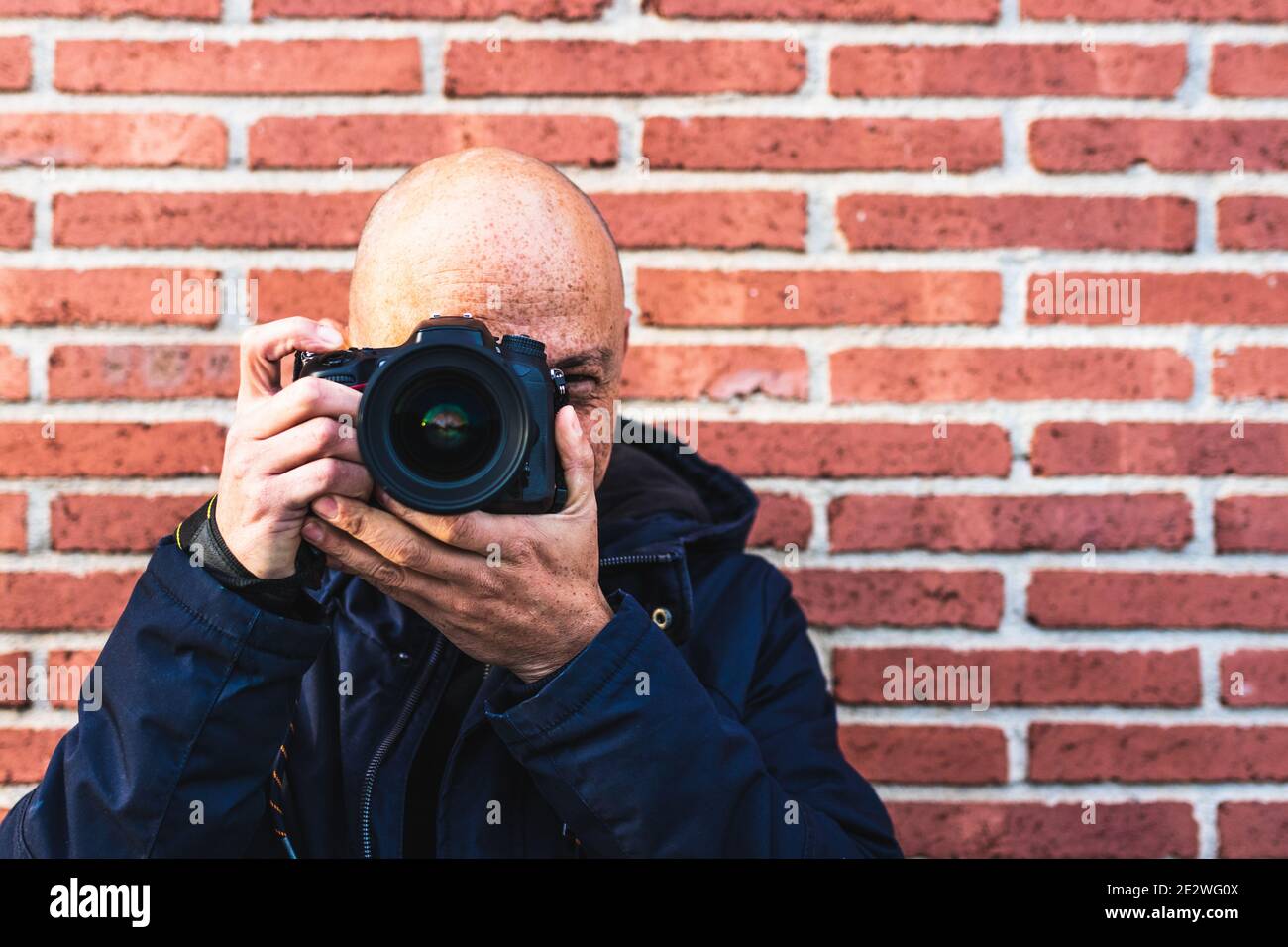 Man Photographing Looking His Camera Posing Smiling Stock Photo