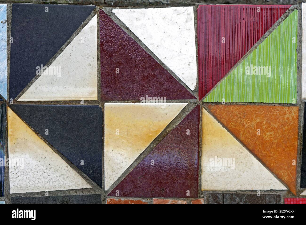 Old floor tiles made from triangular pieces Stock Photo Alamy