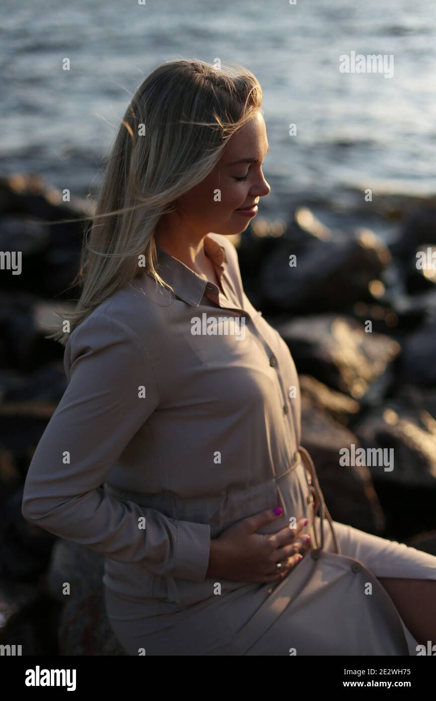 Pregnancy. Happy expectant mother. Pregnant belly. Stock Photo