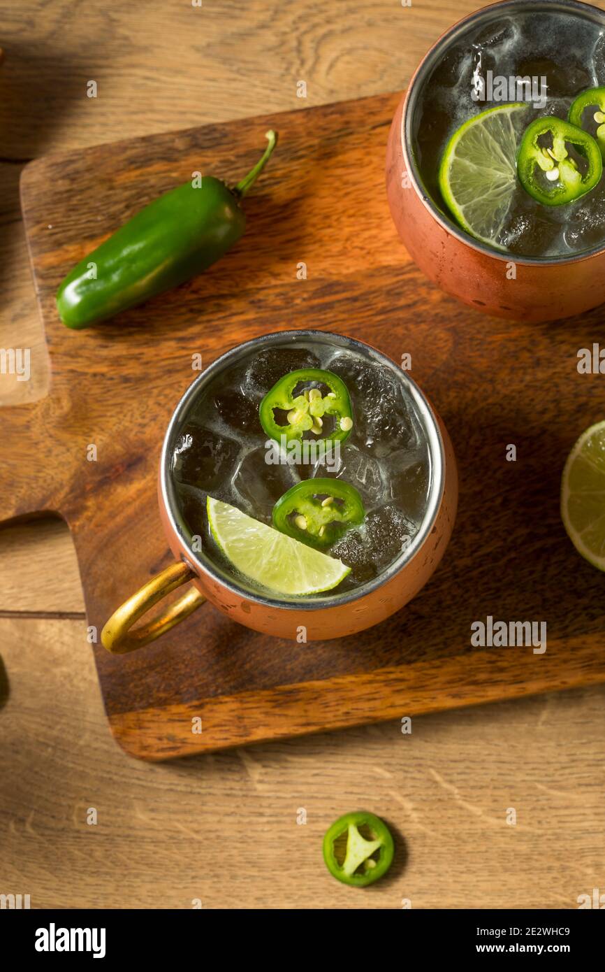 Boozy Refreshing Spicy Jalapeno Tequila Mule with Lime and Ginger Stock Photo