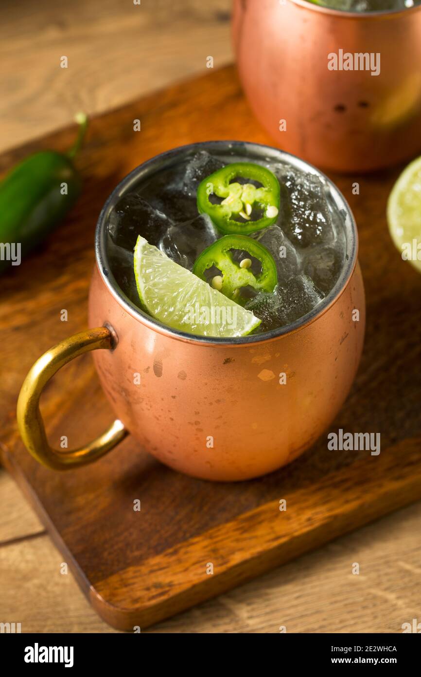Boozy Refreshing Spicy Jalapeno Tequila Mule with Lime and Ginger Stock Photo