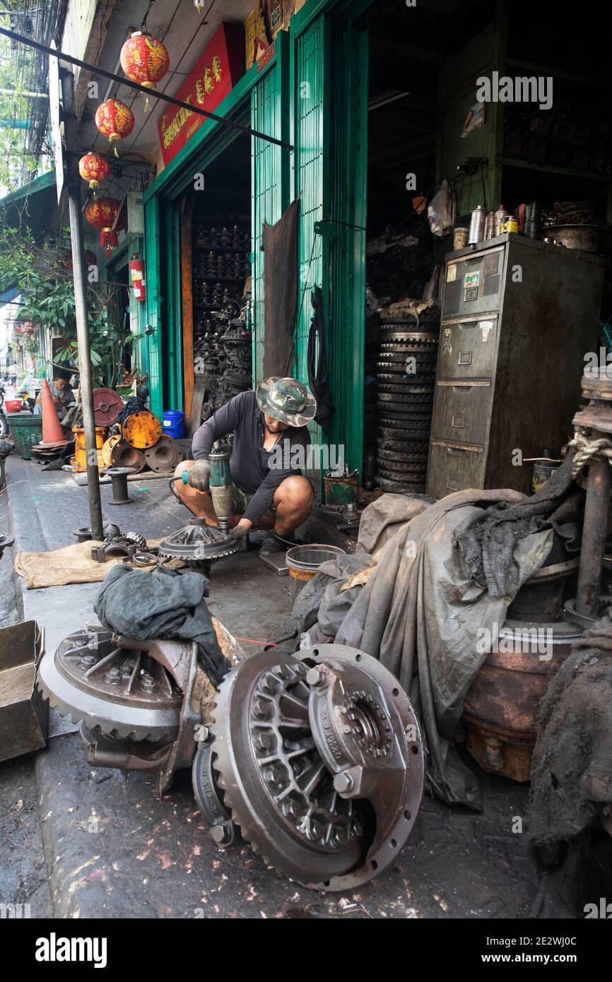 Large Wheel Assemblies Rest of Sidewalk Outside Talat Noi Repair Shop
