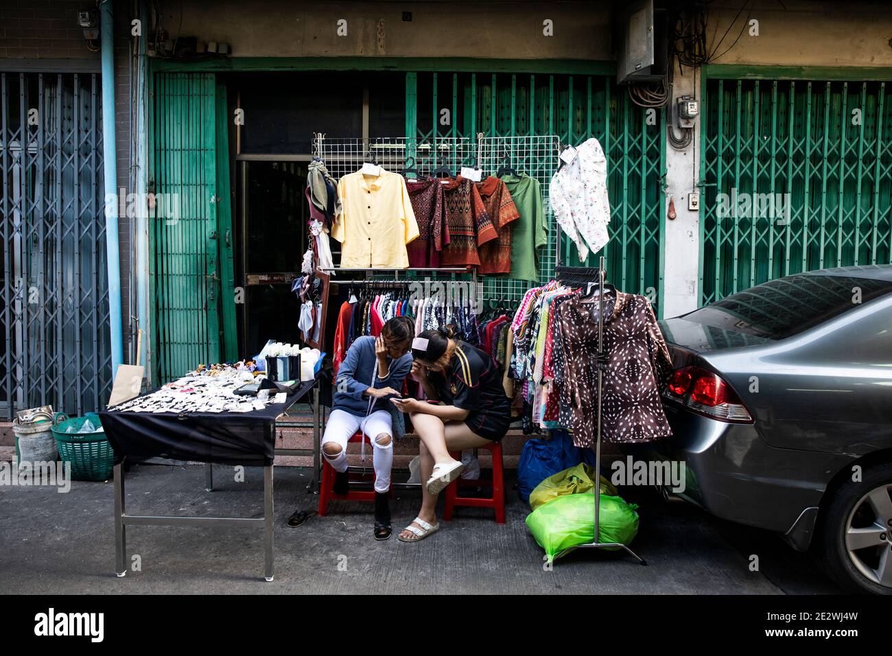 Two Street Entrepreneurs Confer About business in the Talat Noi Stock Photo