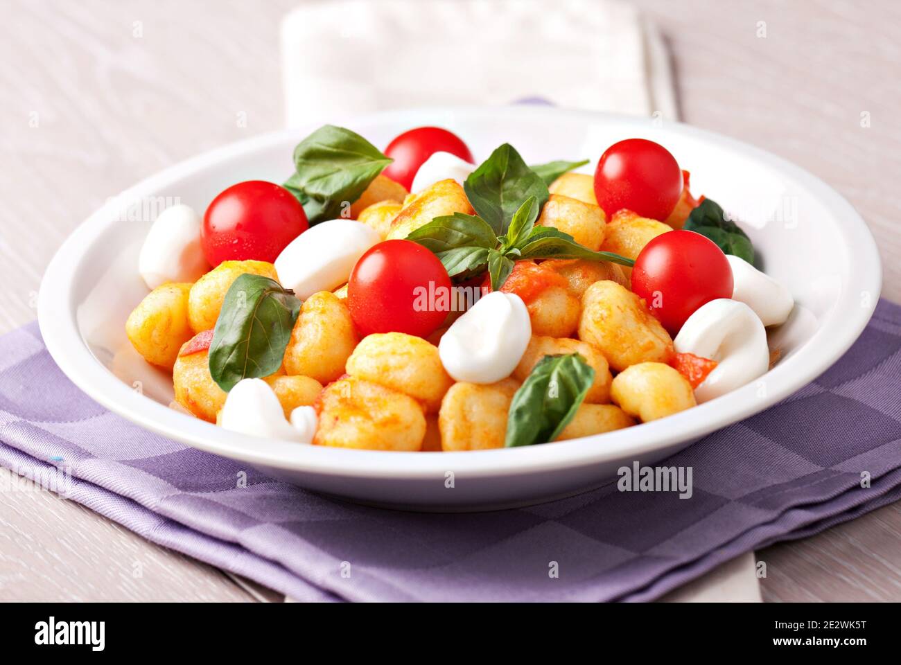 Homemade gnocchi with tomato sauce basil and mozzarella Stock Photo Alamy