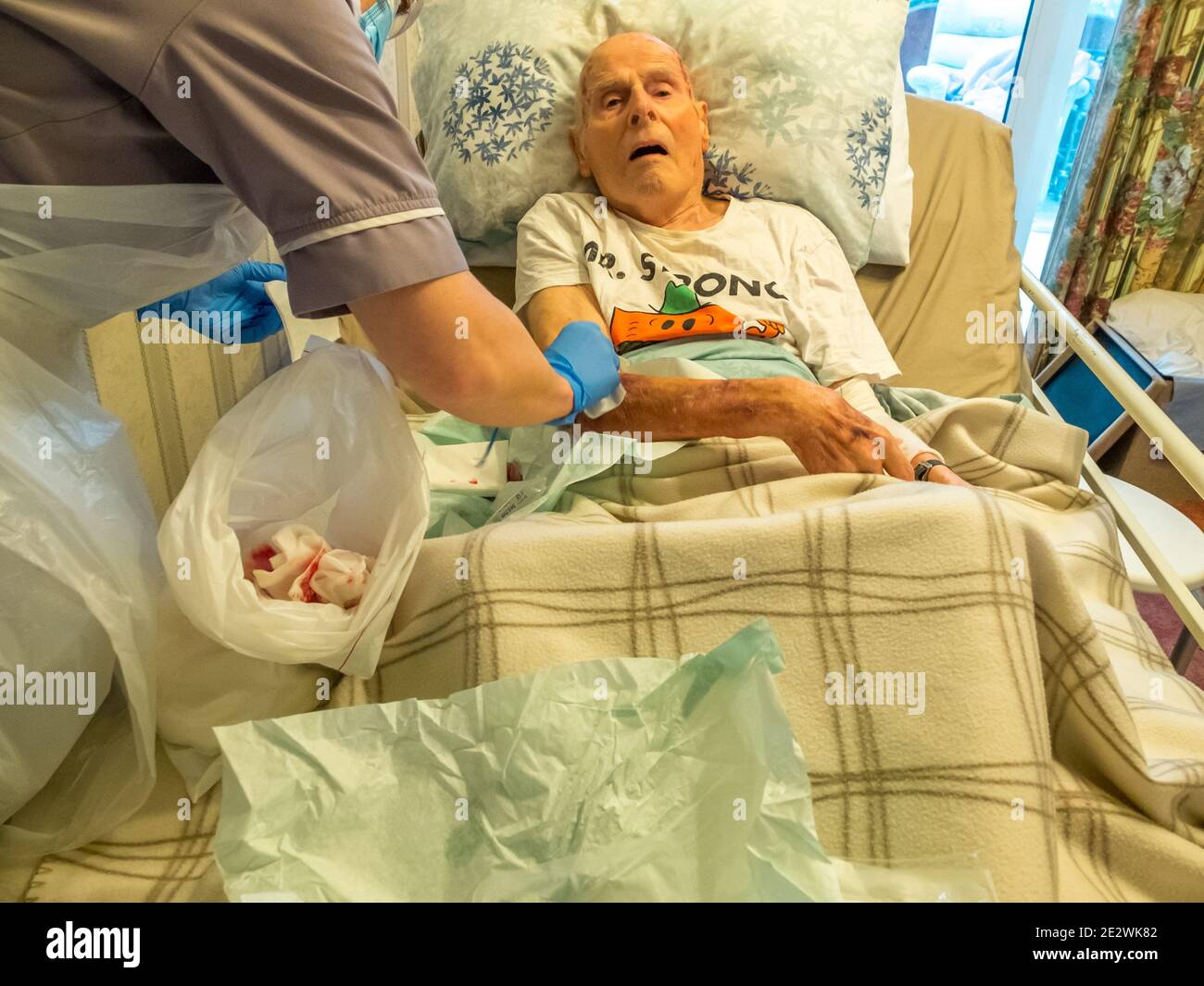 Patient Skin Is Ripped Using Covid-19 protection,a district nurse dresses the 95 year old man ...