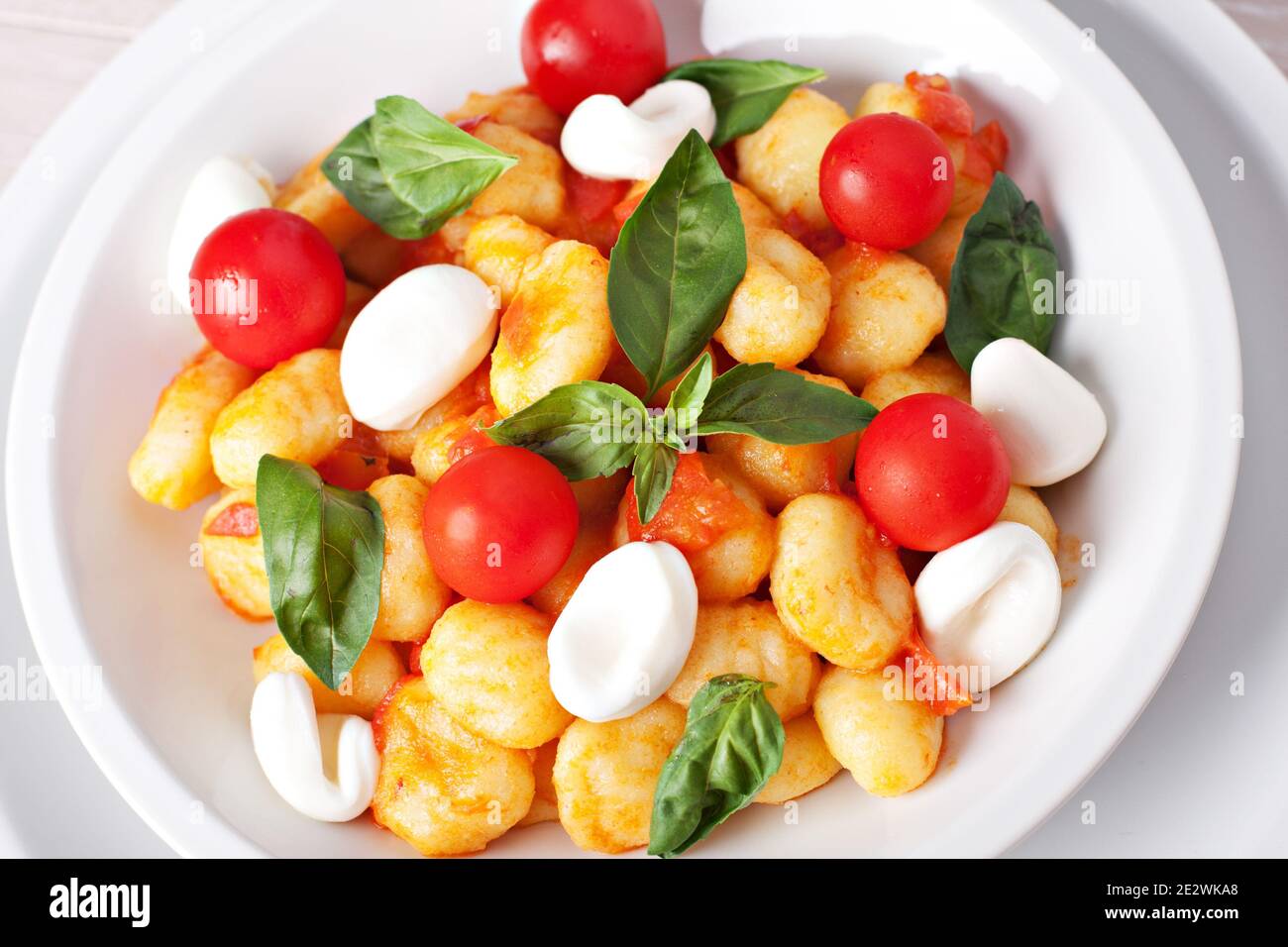 Homemade gnocchi with tomato sauce basil and mozzarella Stock Photo Alamy