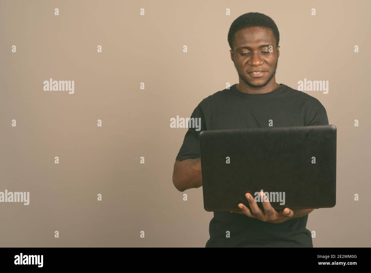 African american young man typing hi-res stock photography and images ...