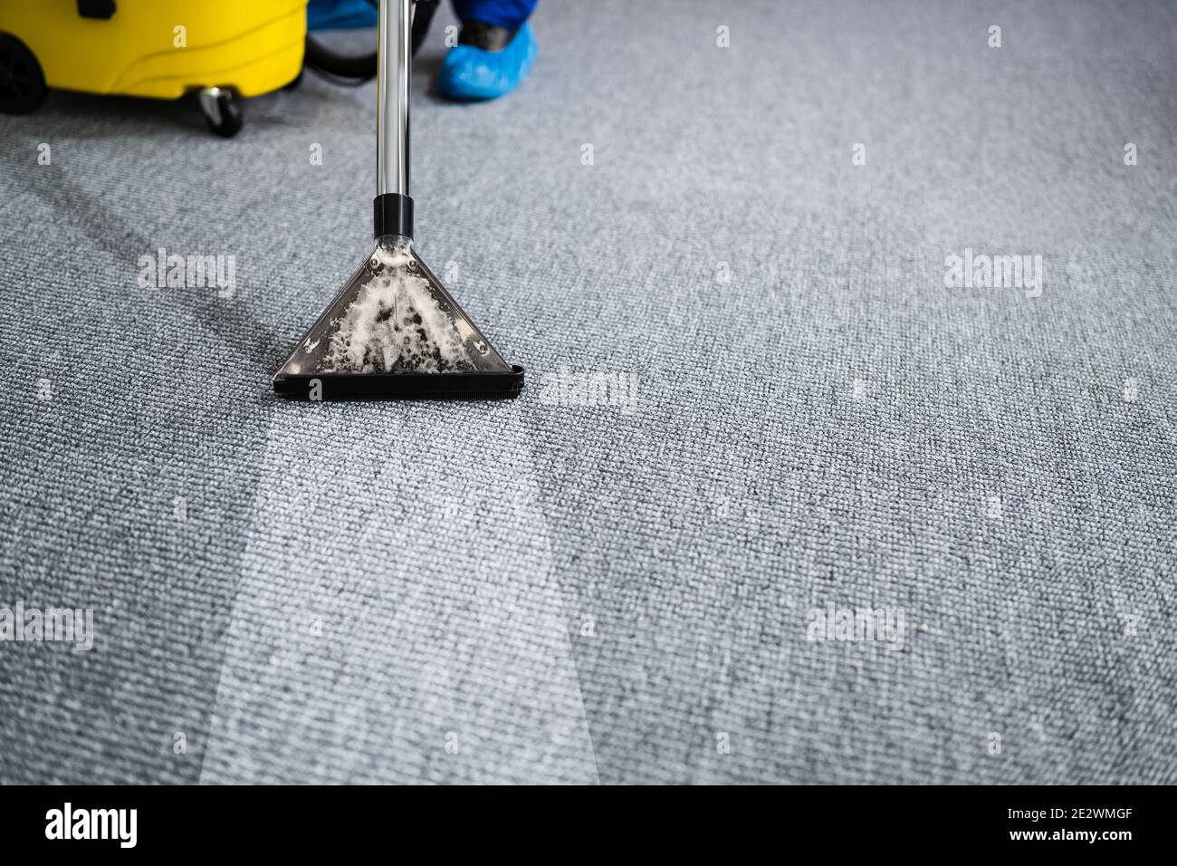 Professional Carpet Cleaning Service. Vacuum Cleaner. Janitor Removing