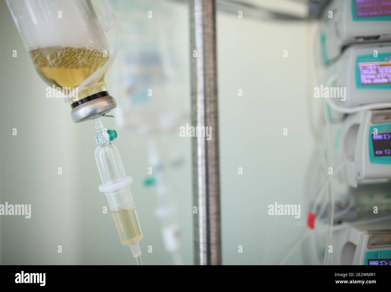 Medical solution bottle hanging on the rack. Stock Photo