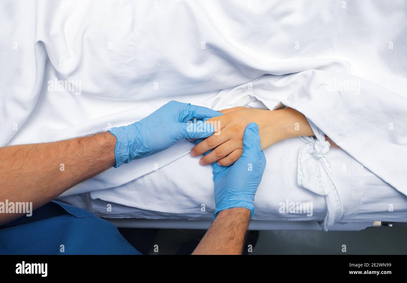 Doctor caring for an incurable patient. Stock Photo