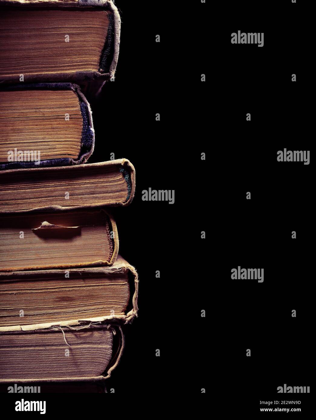 Old used books isolated on the black background Stock Photo Alamy