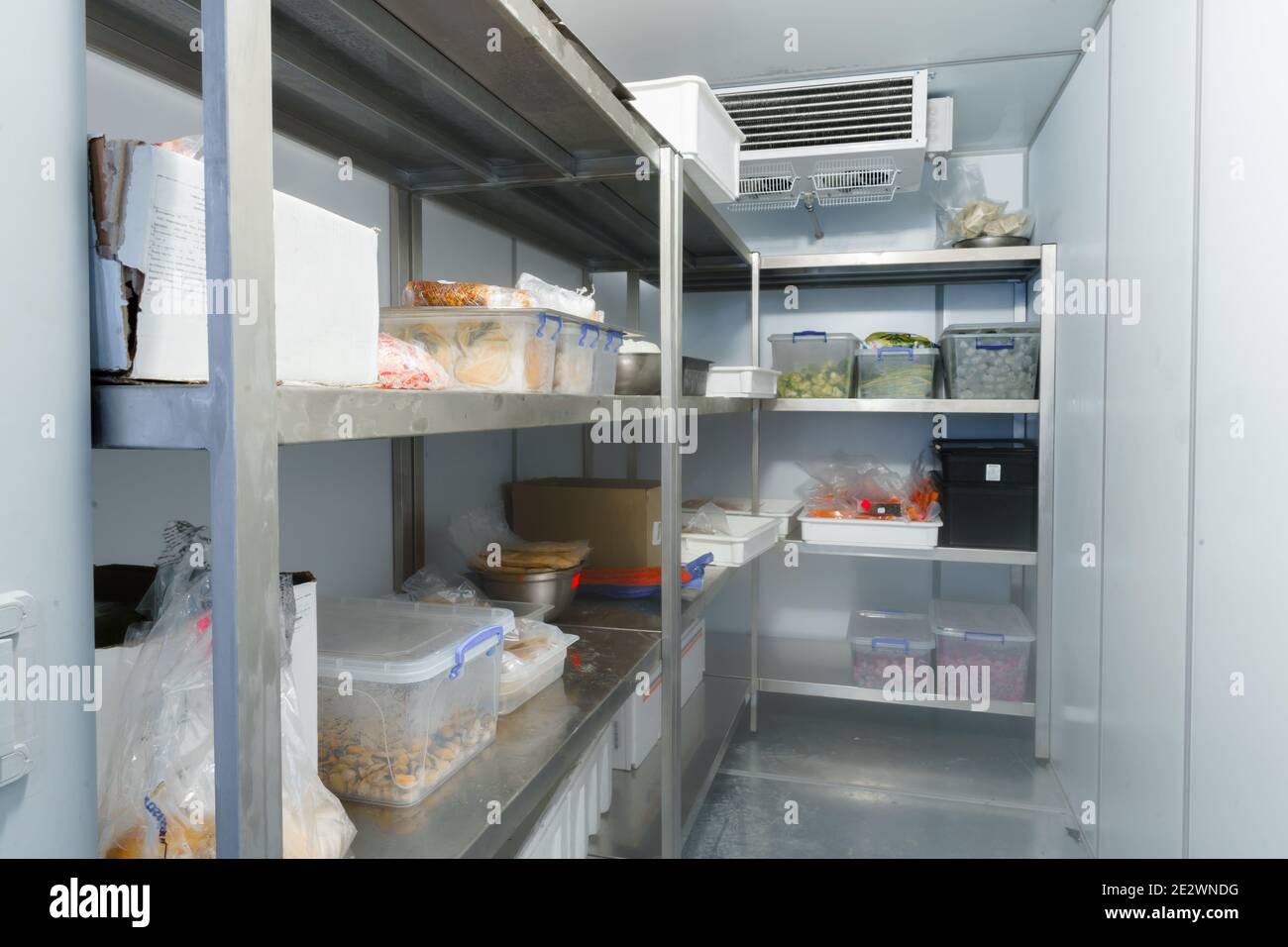 Refrigerator chamber with steel shelves in a restaurant Stock Photo