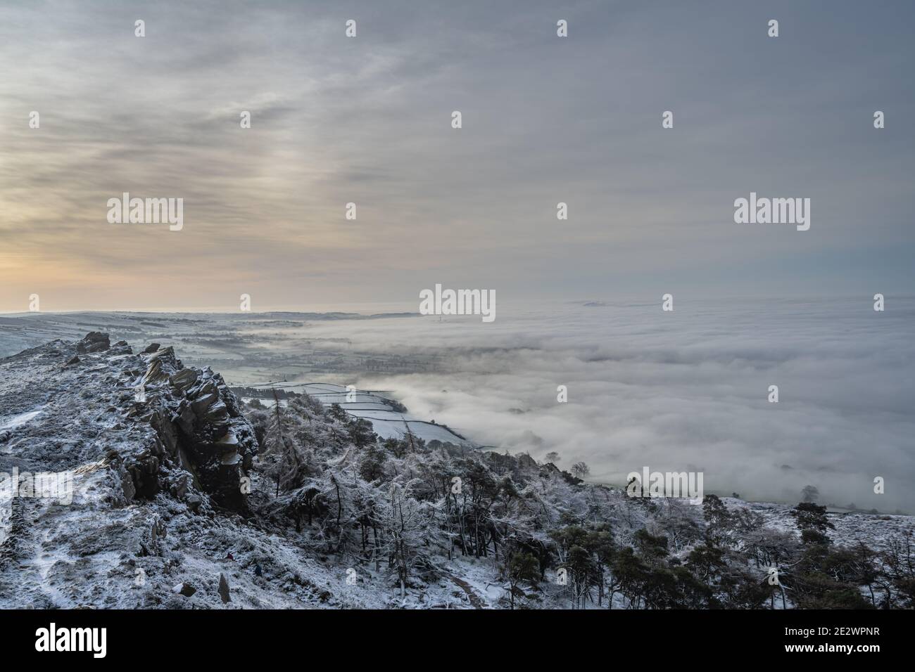 Temperature inversion at The Roaches at sunrise during winter in the Peak District National Park. Stock Photo
