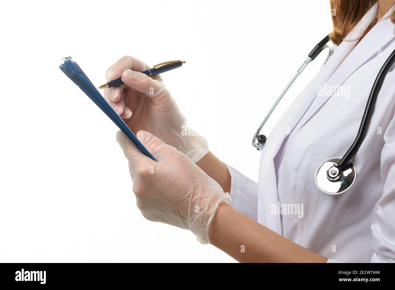 Doctor writes in patients medical hi-res stock photography and images ...