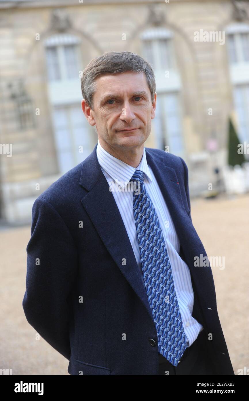 French National police director general Frederic Pechenard leaves