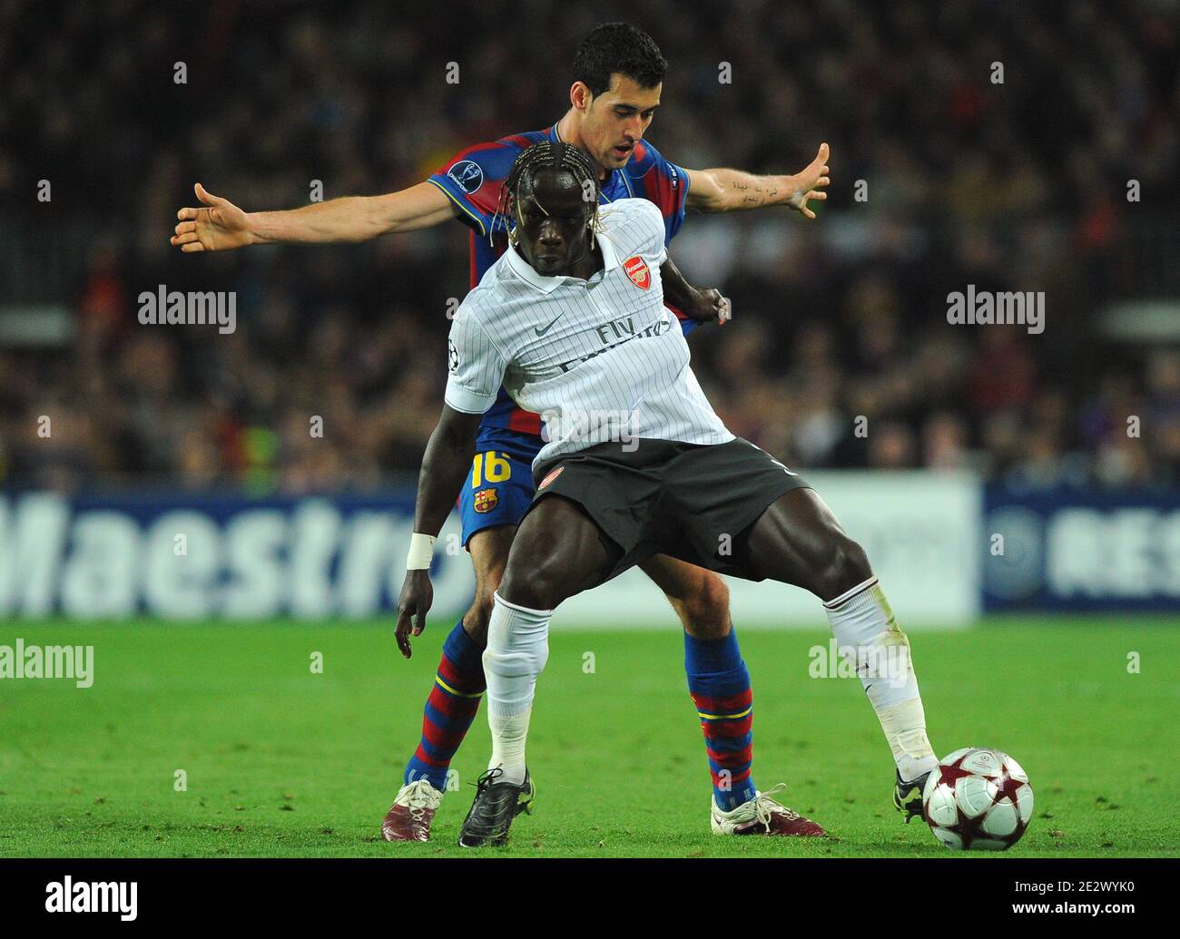 Arsenal's Bacary Sagna challenges Barcelona's Sergi Busquets during the UEFA Champions League,Quarter Final, Second Leg Soccer match, FC Barcelona vs Arsenal at Nou Camp in Barcelona, Spain on March 6, 2010. Barcelona beat Arsenal 4-1 to reach the Champions League semifinals for the third straight year. Photo by Christian Liewig/ABACAPRESS.COM Stock Photo