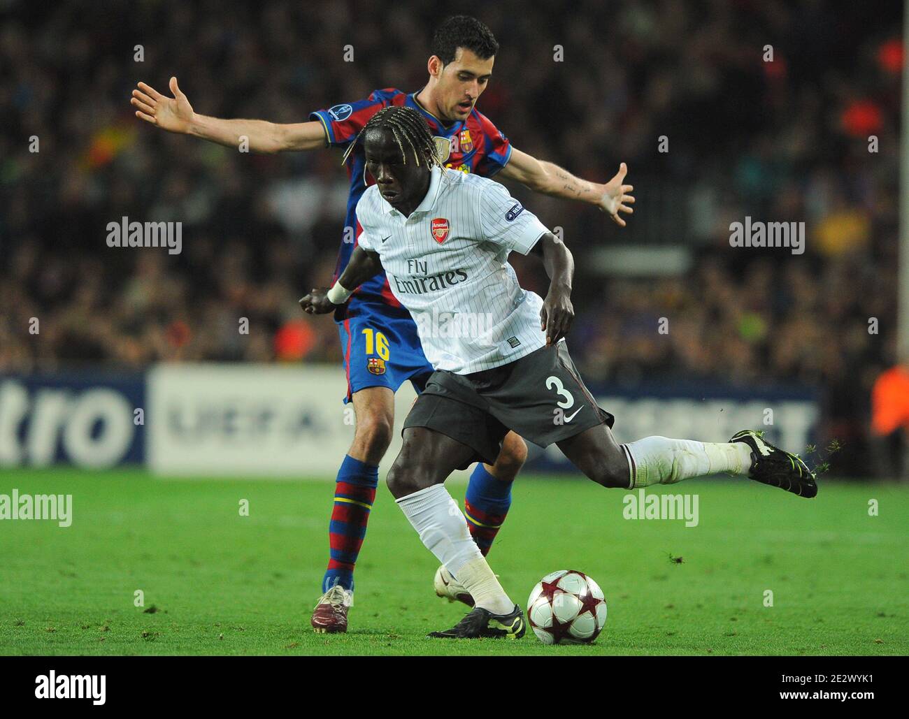 Arsenal's Bacary Sagna challenges Barcelona's Sergi Busquets during the UEFA Champions League,Quarter Final, Second Leg Soccer match, FC Barcelona vs Arsenal at Nou Camp in Barcelona, Spain on March 6, 2010. Barcelona beat Arsenal 4-1 to reach the Champions League semifinals for the third straight year. Photo by Christian Liewig/ABACAPRESS.COM Stock Photo