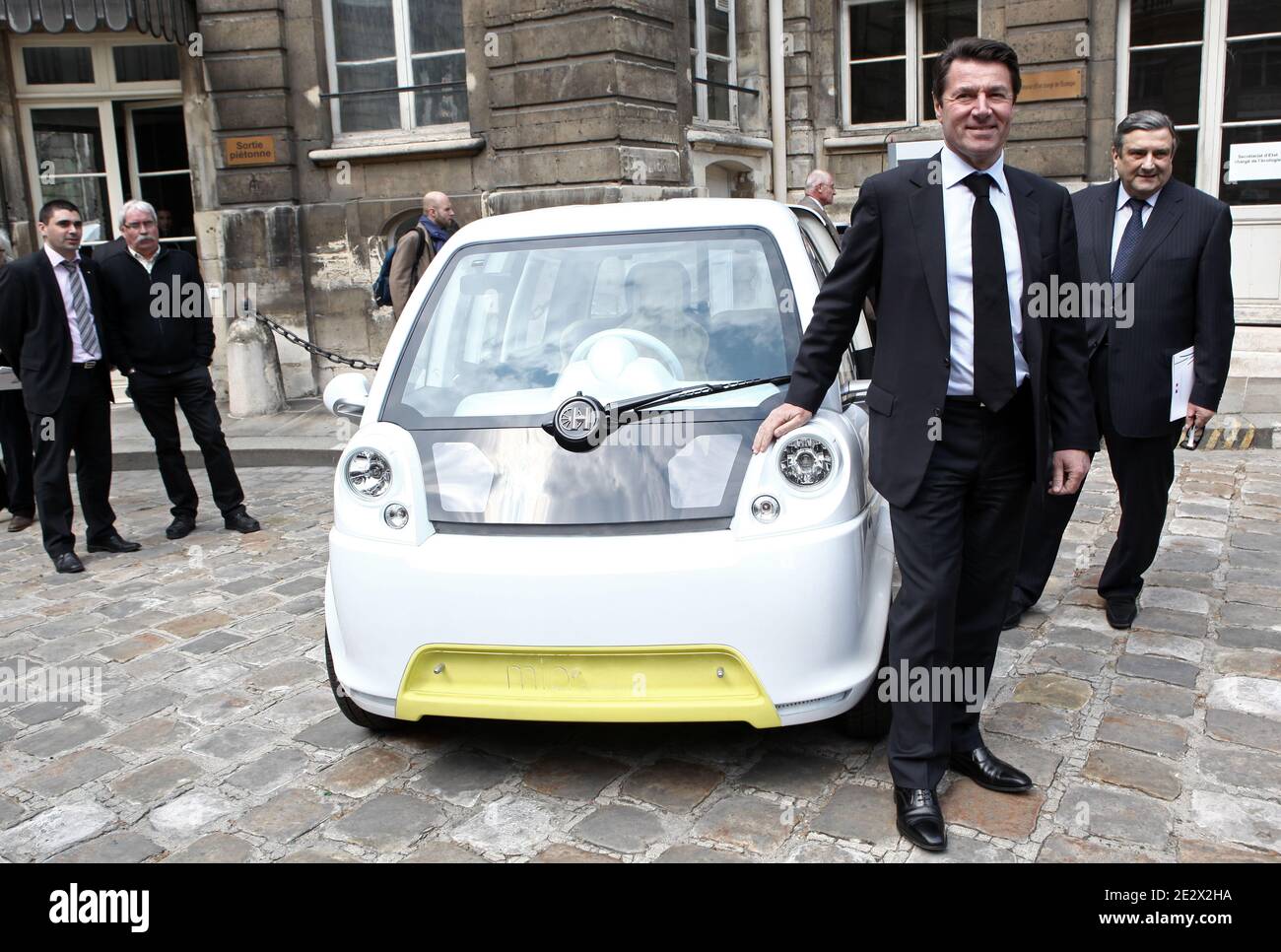 French Minister of Industry Christian Estrosi stands in the Fluence Z.E. (zero emission) Renault concept car in the courtyard of the Ecology ministry after a meeting focus on electric and hybrid cars development in Paris, France on April 13th, 2010. Photo by Stephane Lemouton/ABACAPRESS.COM Stock Photo