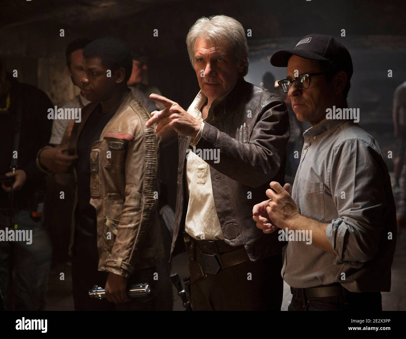 'Star Wars Episode VII: The Force Awakens'. Left to right: John Boyega (Finn), Harrison Ford (Han Solo), and director J.J. Abrams. Stock Photo