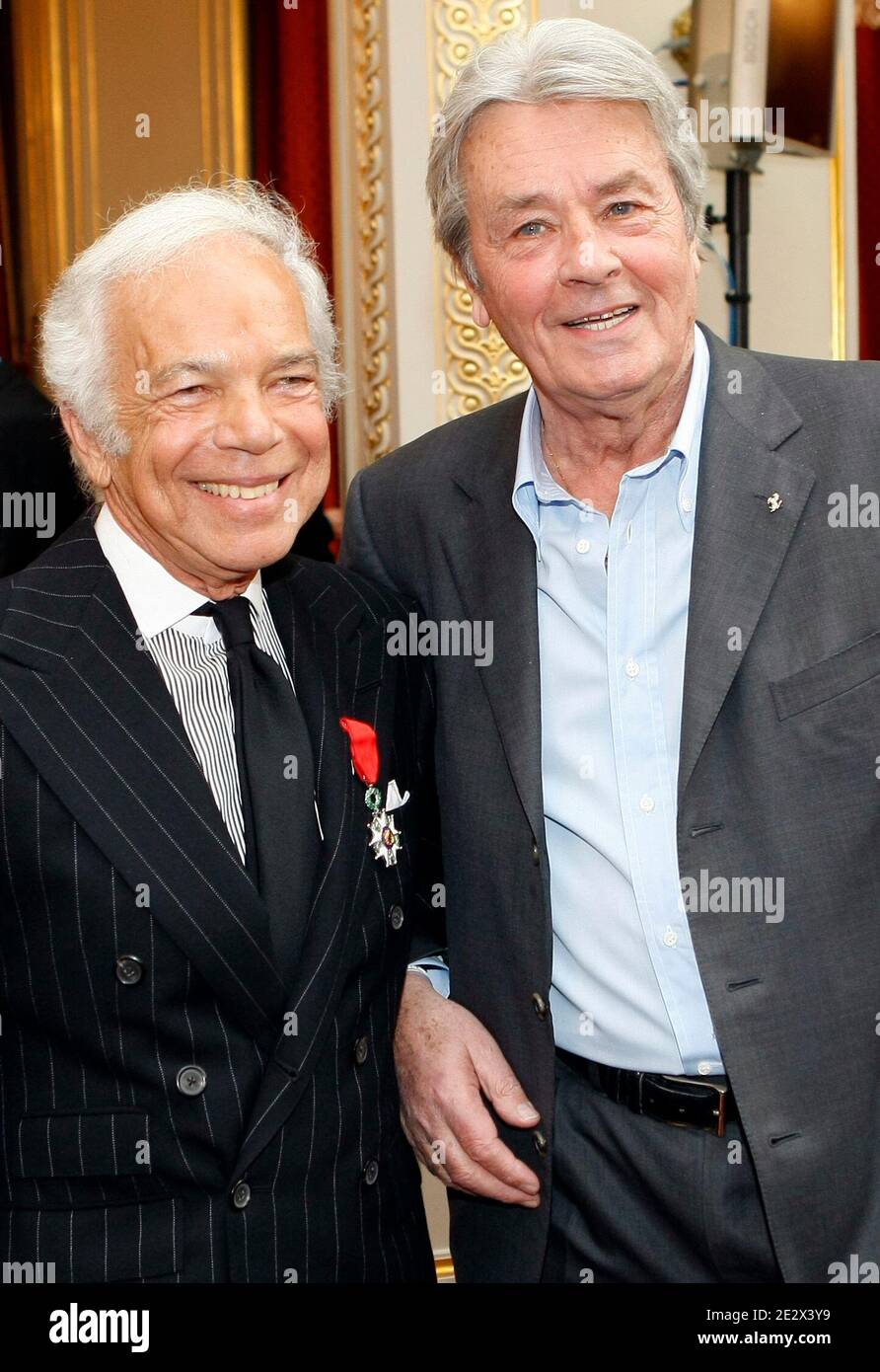 . fashion designer Ralph Lauren, left, poses with French actor Alain  Delon after being awarded Chevalier of the Legion of Honor, one of France's  most prestigious distinctions, by French President Nicolas Sarkozy