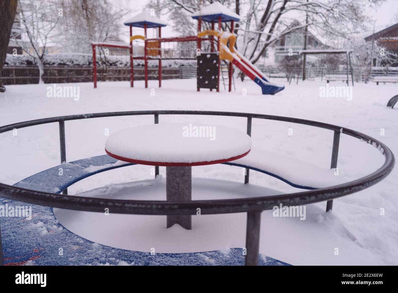 Playground with an outdoor play system covered in the snow in Stock Photo