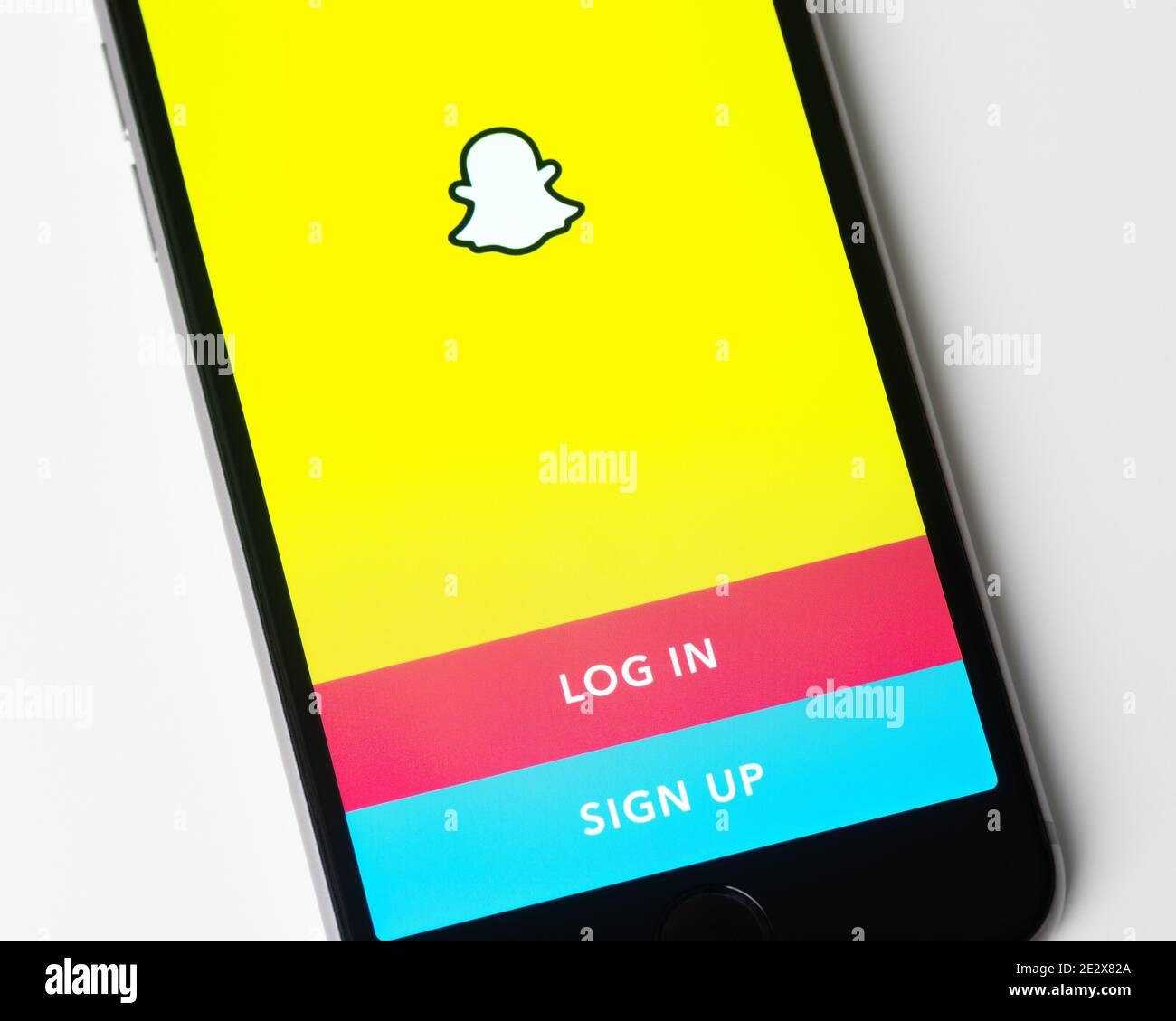 Snapchat app log in and sign up page on Apple iPhone screen. Snapchat is a multimedia messaging app developed by Snap Inc. Stock Photo